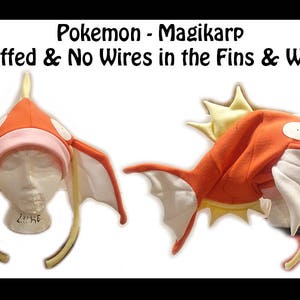 May include: Orange and white Magikarp Pokemon hat with yellow fins and whiskers. The hat is not stuffed and has no wires in the fins and whiskers. "Pokemon - Magikarp (Not Stuffed & No Wires in the Fins & Whiskers)" is written in black text on a white background.