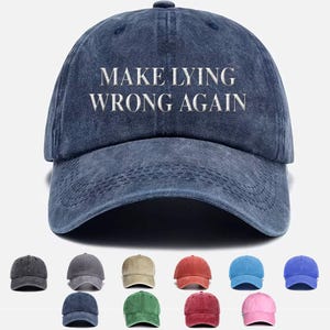 May include: A blue denim baseball cap with the text "MAKE LYING WRONG AGAIN" embroidered in white. The cap is available in a variety of colors.