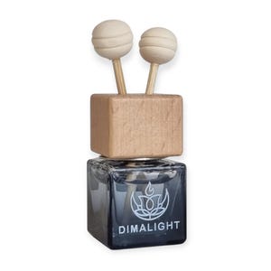 May include: A black square glass bottle with a wooden top and two wooden ball-shaped diffusers. The bottle has the word "DIMALIGHT" printed on it in white. The top is a light brown color.
