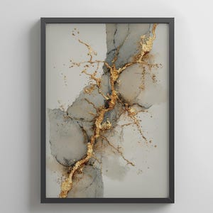 May include: Abstract art print in a black frame. The artwork features a gold vein-like design against a backdrop of gray and beige watercolor-style shapes. The gold elements have a textured, metallic appearance.