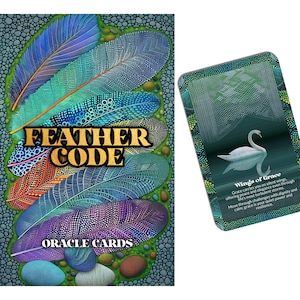 May include: An oracle card set with vibrant feather illustrations and the text "FEATHER CODE ORACLE CARDS." A second card displays a swan and the text "Wings of Grace." The cards have a nature theme.