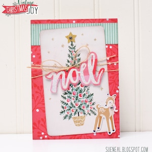 May include: A pink and white Christmas card with a green and gold Christmas tree, a deer, and the word "no&euml;l" in pink glitter letters.