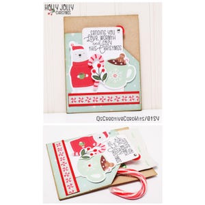 May include: A handmade Christmas card with a pop-up design featuring a polar bear wearing a red sweater, a mug of hot chocolate with a gingerbread man, and a candy cane. The card has a message that reads "Sending you love, warmth and cozy this Christmas".