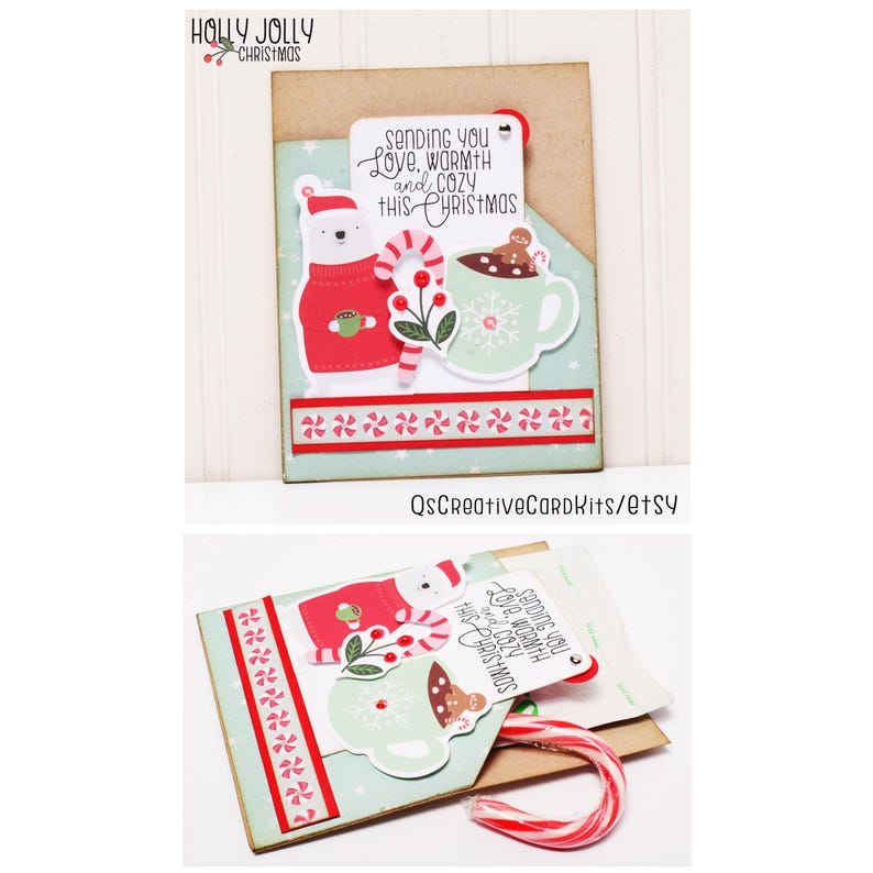 May include: A handmade Christmas card with a pop-up design featuring a polar bear wearing a red sweater, a mug of hot chocolate with a gingerbread man, and a candy cane. The card has a message that reads "Sending you love, warmth and cozy this Christmas".
