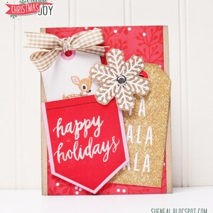 May include: A red and gold Christmas card with a snowflake, a deer, and the text "happy holidays" and "A LA LA".