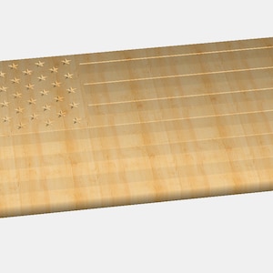 May include: A wooden cutting board with an American flag design carved into the surface. The board is light brown in color and has a slightly rounded edge.