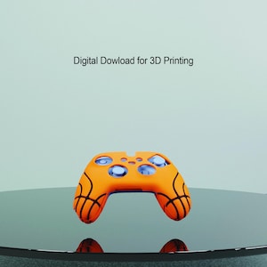 Può includere: Controller per videogiochi stampato in 3D arancione e nero con un design a pallacanestro. Download digitale per la stampa 3D.