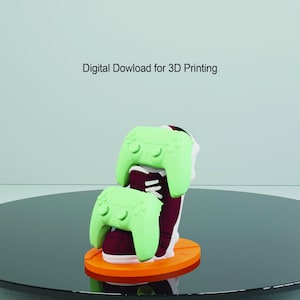 May include: A 3D printed model of a shoe with two green video game controllers on top. The shoe is maroon with white accents. The controllers are light green and have a textured surface. The model is sitting on an orange base. Digital Dowload for 3D Printing.