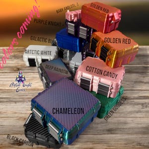 May include: A collection of colorful cases in various shades, including Golden Red, Cotton Candy, and Galactic Blue. The cases are labeled with color names and feature a textured design. The image also includes the text "More colors coming!"