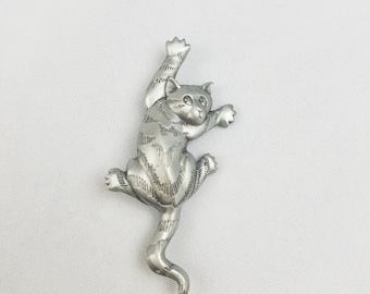 Spilla vintage JJ Jonette a forma di gatto che si arrampica, colore argento, 1988