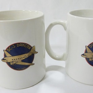 DC-Dakota white coffee mug memorabilia advertising set of 2 image 1