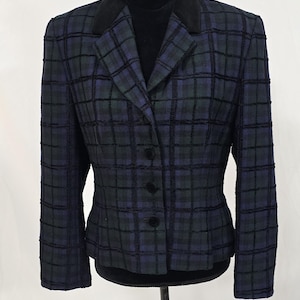 May include: A set of three ceramic mugs with a speckled, matte finish. The mugs are in shades of cream, light gray, and dark gray. Each mug has a simple, minimalist design and a rounded handle.