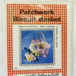 May include: A craft pattern for a patchwork biscuit basket. The pattern is titled "Patchwork Biscuit Basket" and includes instructions for making baskets for all seasons, including Easter, Christmas, Valentine's Day, and Autumn. The pattern is from Creative Makings by Martie, P.O. Box 4445, Glendale, California 91202.