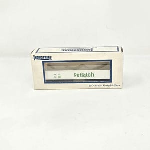 May include: A model train box with the word "Potlatch" in green lettering. The box is white with blue trim and the words "HO Scale Freight Cars" are printed on the bottom.