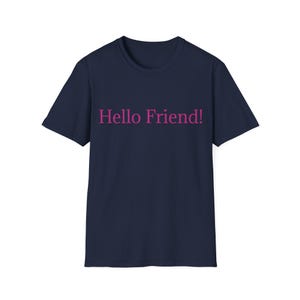 May include: A dark navy blue short-sleeved t-shirt featuring the text Hello Friend! printed in a bold pink font across the centre of the chest. The garment has a classic crew neckline and a straight hemline, providing a simple and clean design.