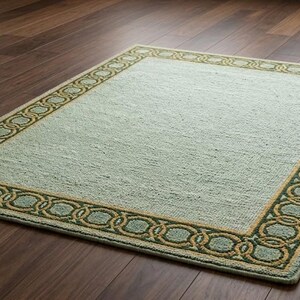 Elegante alfombra de pelo rizado verde salvia con borde decorativo geométrico de eslabones de cadena: alfombra texturizada artesanal de primera calidad para sala de estar.