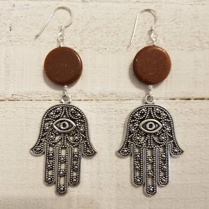 Hamsa swinging earrings with polished sunstone sparkling stone disc&#39;s.