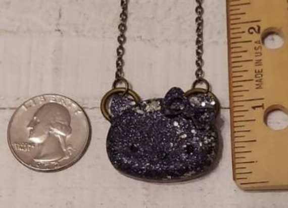 The Hello Kitty Black and Fine Silver Glitter Resin Charm