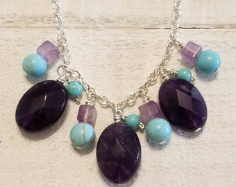 Faceted oval stone Amethyst necklace drops with turquoise stones.
