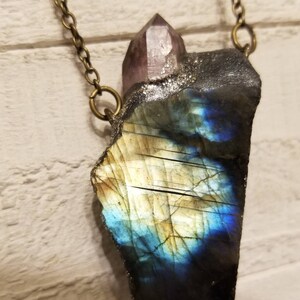 The High Flash Free Form Labradorite Crystal Amulet Slab with Amethyst Point.