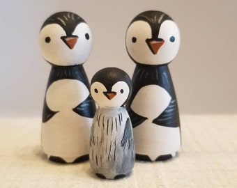 The Hand Painted Penguin Peg Doll family trio.
