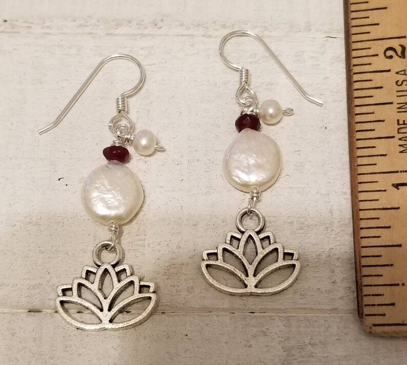 Blooming lotus flower drop earrings with garnets and fresh water pearls.
