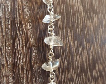 The Seven Stone Clear Quartz Crystal Energy Drop Necklace on Sterling Silver.