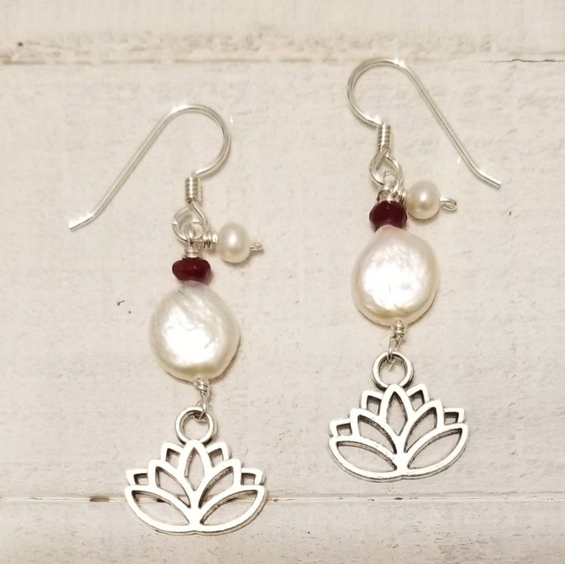 Blooming lotus flower drop earrings with garnets and fresh water pearls.