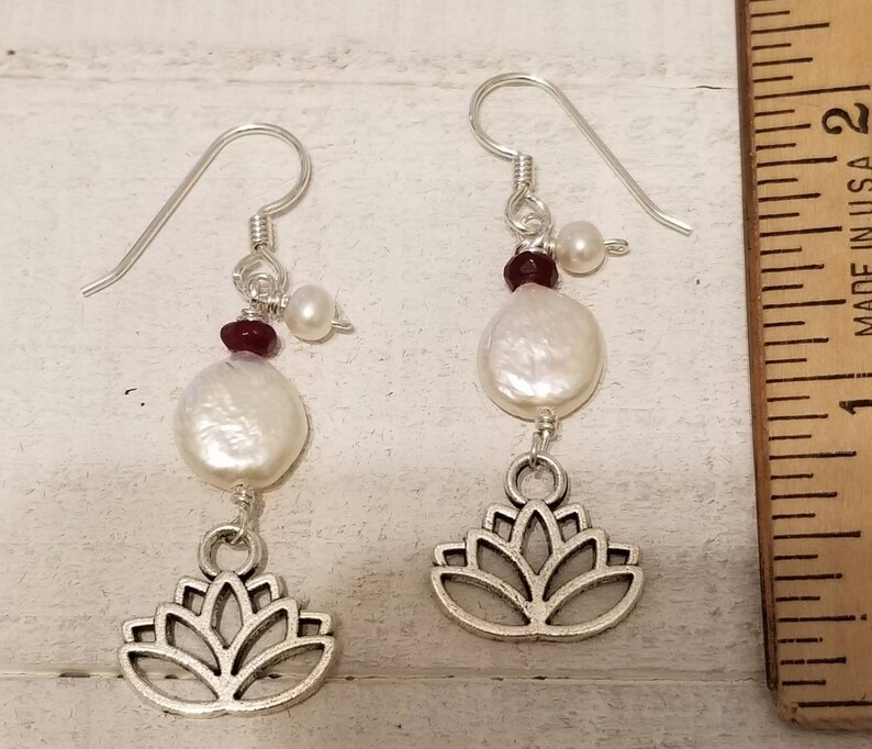 Blooming lotus flower drop earrings with garnets and fresh water pearls.