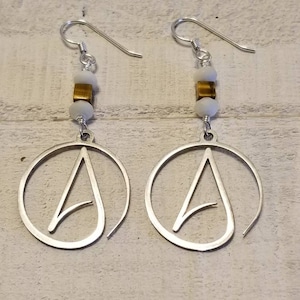 The Atheist symbol charm earrings with mother of Pearl stones and tiger&#39;s eye beads.