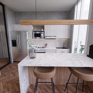 Puede incluir: Una isla de cocina de mármol blanco con dos taburetes de bar de madera. La isla tiene una encimera de madera y un fregadero de acero inoxidable. La cocina tiene un diseño moderno con paredes grises y un refrigerador de acero inoxidable.