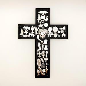 Milagros Cross Folk Art, Milagro Cross Wall Decor, Milagro Mexican Folk Art made of black-painted wood & adorned with miracle charms.