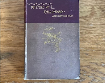 May include: A vintage book titled "Rhymes of Childhood" by James Whitcomb Riley. The cover is a dark purple with gold lettering and a gold illustration of a child's face.