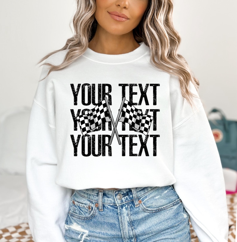 May include: White sweatshirt with black text that says "YOUR TEXT" and a checkered flag graphic.