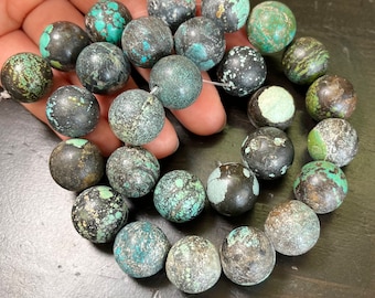 15mm Turquoise Rounds, from Hubei, China. Heavy Matrix. Raw stone, unstabilized. 16.6 inch strand.