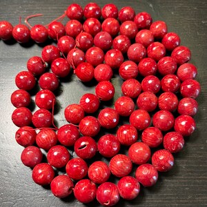 10-11mm Bamboo Coral Faceted Rounds, Cranberry Red, 16 inch strand.