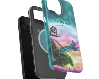 May include: Three phone cases stacked together. The front case is teal with a colorful illustration of a cat jumping off a cliff, an owl, and the text "O - The Fool". The middle case is gray with a compass design. The back case is black.