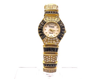 Orologio vintage Xanadu con strass: gioiello d'avanguardia color oro degli anni '80.