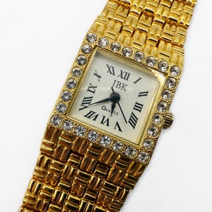 JBK Jacqueline Kennedy Vintage Gold Tone Watch with Rhinestone Bezel Roman Numerals Quartz Bracelet Watch Classic Elegant Style