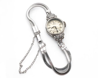 Reloj de cóctel Art Déco vintage de 18 quilates con diamantes: Oro blanco y platino, movimiento mecánico CYMA.