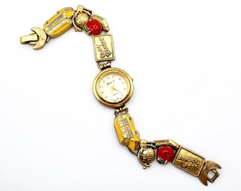 Orologio con bracciale e ciondoli in smalto color oro vintage Jennie B: tema scolastico