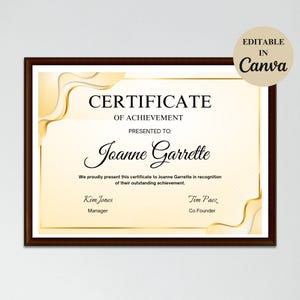 May include: A gold and white certificate of achievement with a decorative border. The certificate is presented to Joanne Garrette. The text "CERTIFICATE OF ACHIEVEMENT" is at the top of the certificate. The text "PRESENTED TO: Joanne Garrette" is below the title. The text "We proudly present this certificate to Joanne Garrette in recognition of their outstanding achievement." is below the name. The text "Kim Jones Manager" is in the bottom left corner. The text "Tim Paez Co Founder" is in the bottom right corner.