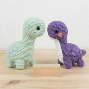 May include: A set of three ceramic mugs with a speckled, matte finish. The mugs are in shades of cream, light gray, and dark gray. Each mug has a simple, minimalist design, perfect for coffee or tea.