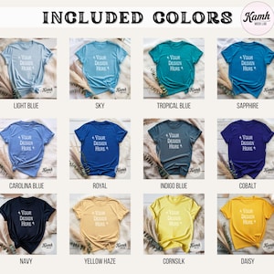 May include: A product mockup featuring a variety of t-shirts in different colors, including light blue, sky, and navy. Each shirt has the text "Your Design Here" printed on it. The image also includes the text "Included Colors".