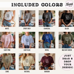 May include: A product image showcasing t-shirts in various colors, including white, sport grey, charcoal, and black. Each shirt features the text "Your Design Here" and is displayed on a model. The image also includes colors like light pink, light blue, royal, military green, sand, natural, and maroon.