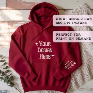 May include: A maroon hoodie with a front pocket and hood. The text "Your Design Here" is printed on the front and sleeve. The image also includes the text "HIGH-RESOLUTION 300 DPI IMAGES" and "PERFECT FOR PRINT ON DEMAND".