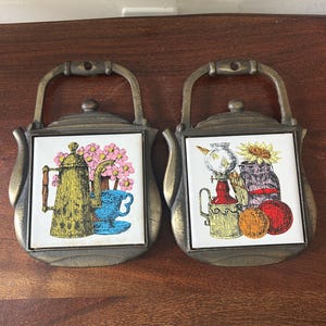Vintage Cherry Brand cast iron and ceramic teapot shaped trivets or wall hangings
