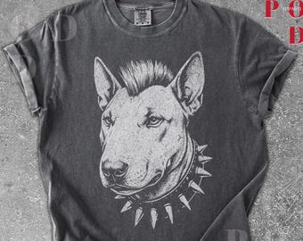 May include: Dark gray t-shirt featuring a detailed white illustration of a Bull Terrier dog with a spiked collar and a mohawk hairstyle. The shirt has rolled-up sleeves and a crew neck. The word "PEPPER" is in a red burst shape.