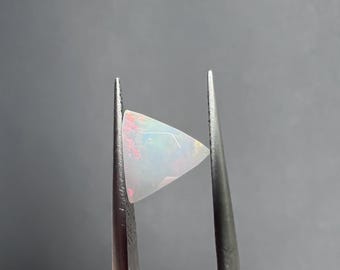 Natural Wolo Fire Opal .85Ct. Origin Ethiopia. Facet Trillion. Jewelry Calibrated AAA