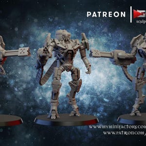 May include: Three grey unpainted miniature robot figures standing on circular black bases. Each robot features a mechanical design with a large multi-barreled weapon attached to one arm, a backpack unit, and text reading PATREON GHAMAK.
